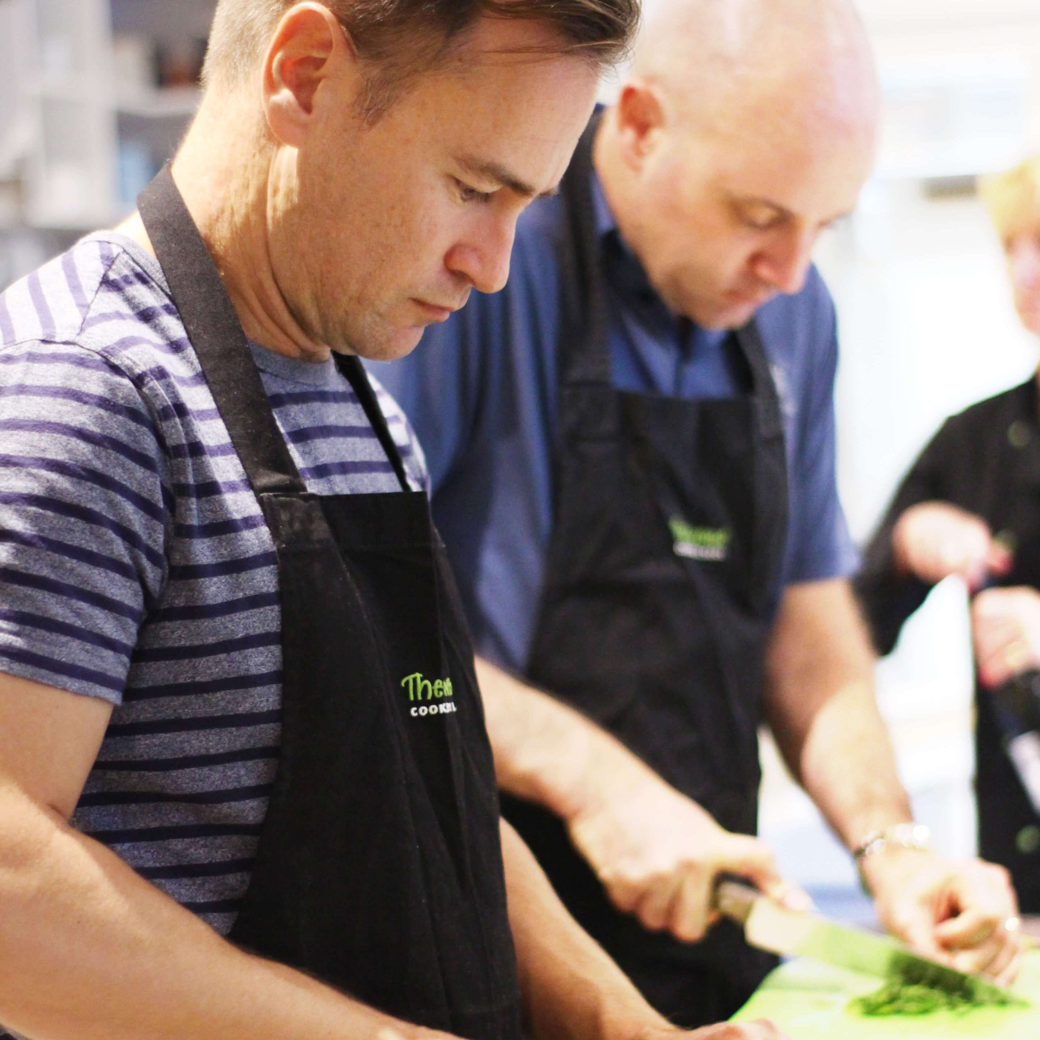 Men chopping garlic (Beth)